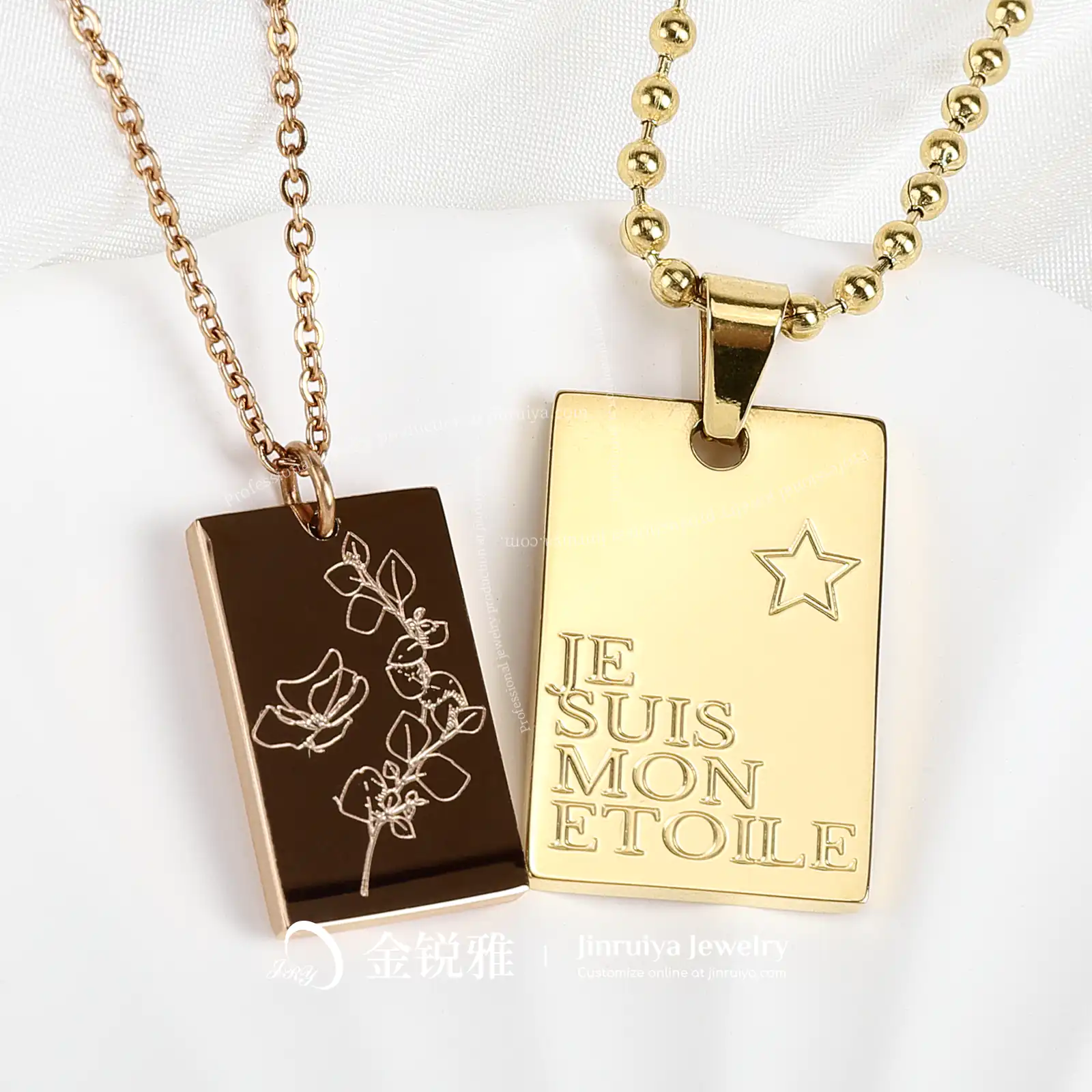 Display of square engraved pattern and text pendant necklace