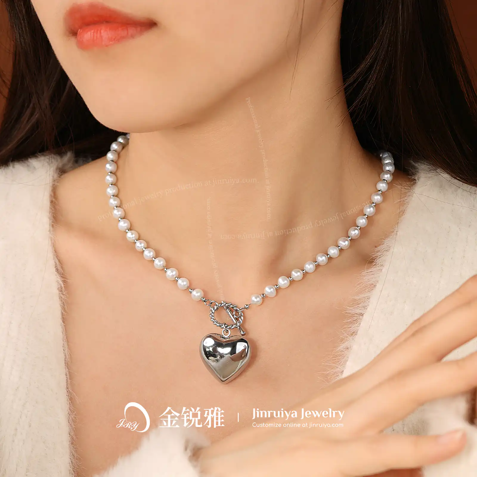 Model wearing a heart pendant pearl necklace