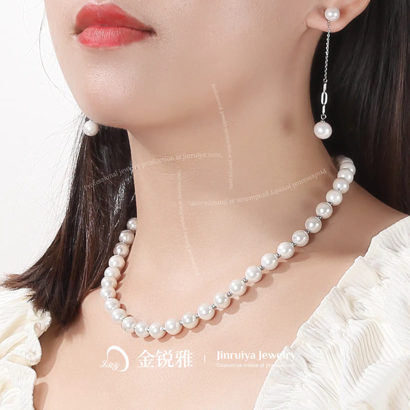 Model wearing a spaced beaded pearl necklace