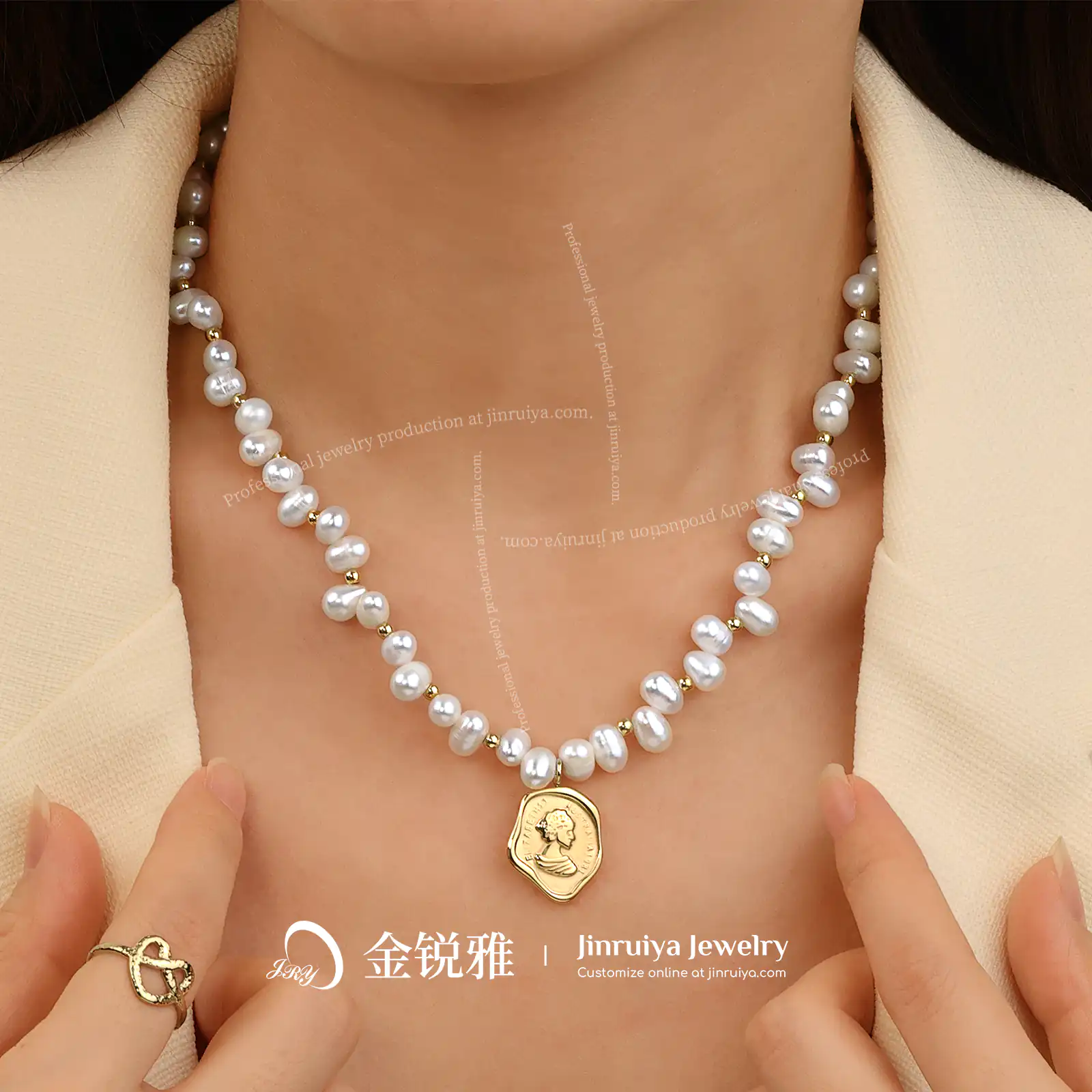 Model wearing a pearl pendant necklace